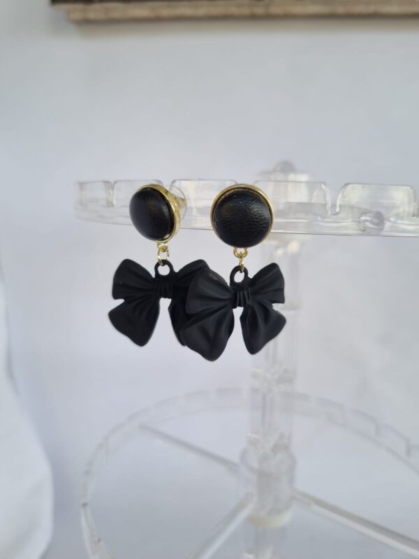 Sleek matte black bow tangle earrings