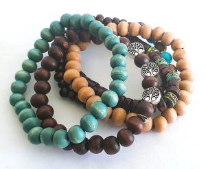 Natural wooden bead stackable bracelets in turquoise, brown and beige tones with tree charm details from Stella’s Earrings in Moreletapark Pretoria East South Africa