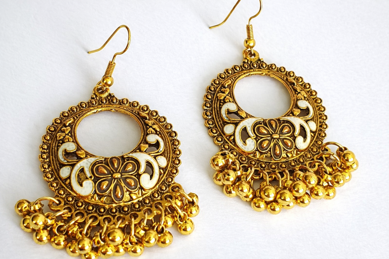 Gold statement drop earrings with ornate detail and hanging bead accents from Stella’s Earrings in Moreletapark Pretoria East South Africa